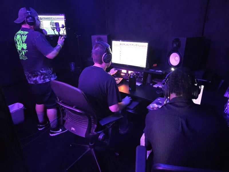At the booth screen getting the next one ready while the desk holds it down