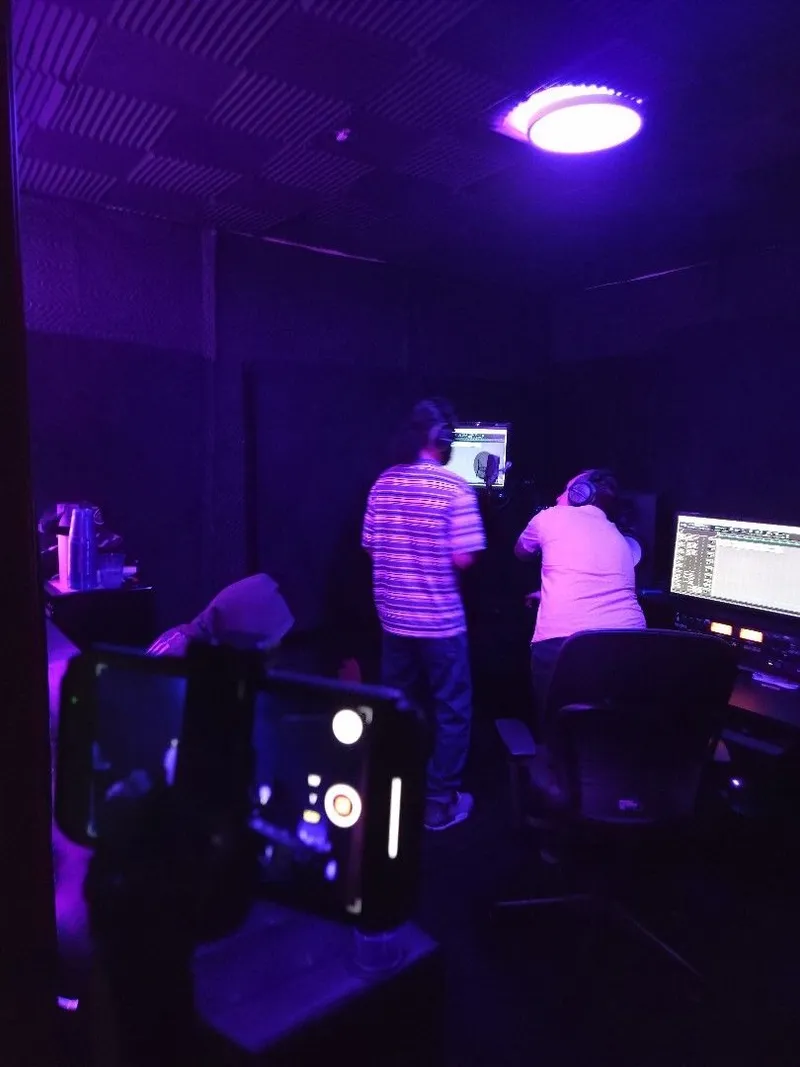 The phone rig rolling while the take goes down at the booth
