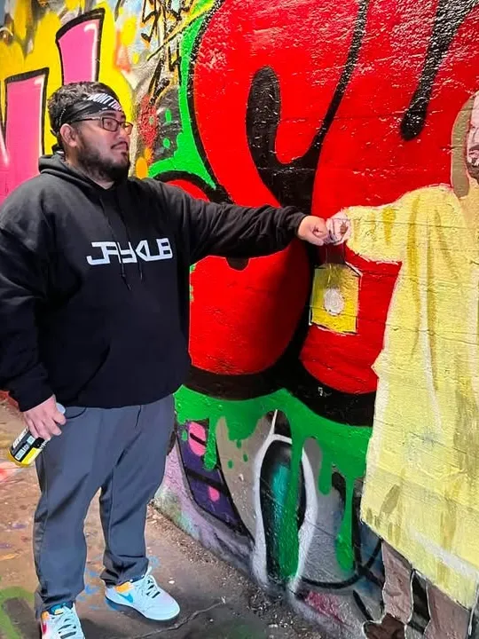 At the mural wall, JAYKUB hoodie
