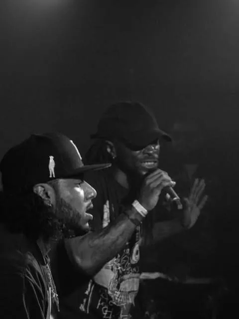 On stage, mic in hand
