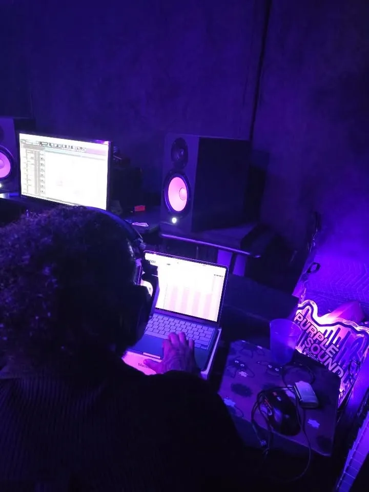 A take going down at the booth wall while the room works around it