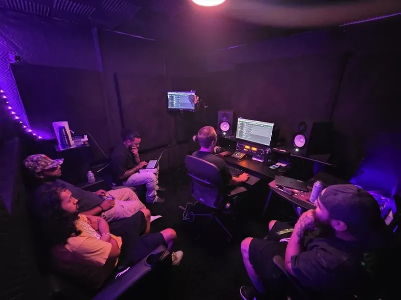 Everybody working — the desk on the session, the couch on the pens