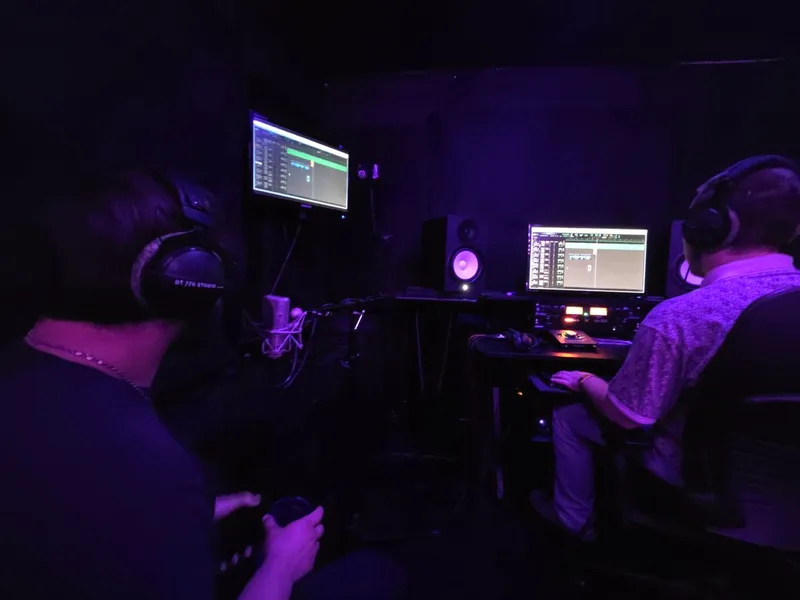 Two on the session — one in headphones, one driving